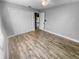 A spacious bedroom with modern flooring, ceiling fan, and closet at 3184 Wessex Way, Clearwater, FL 33761