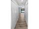 Hallway with wood floors leads to the sunroom and pool area at 3184 Wessex Way, Clearwater, FL 33761