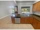 Kitchen features granite countertops, wood cabinets, and stainless steel appliances at 3184 Wessex Way, Clearwater, FL 33761