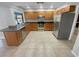 Well-equipped kitchen with stainless steel appliances, granite countertops, and ample cabinet space for efficient meal preparation at 3184 Wessex Way, Clearwater, FL 33761