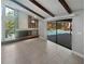 Open living room featuring vaulted ceiling, fireplace and sliding glass door to the pool at 3184 Wessex Way, Clearwater, FL 33761