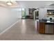 Living room featuring tile flooring, exposed ceiling beams and view to the pool and back yard at 3184 Wessex Way, Clearwater, FL 33761