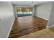 Bright living room with sliding glass doors provides a seamless transition to the outdoor pool area at 3184 Wessex Way, Clearwater, FL 33761