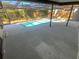 Large deck surrounding an enclosed pool, creating ample space for outdoor activities and enjoyment at 3184 Wessex Way, Clearwater, FL 33761