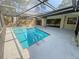 Relaxing enclosed pool area, providing a private outdoor retreat with ample space for lounging and entertaining guests at 3184 Wessex Way, Clearwater, FL 33761