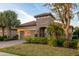 Beautiful home exterior with stone accents and a two-car garage at 13219 Palermo Dr, Lakewood Ranch, FL 34211