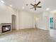 Bright living room featuring a stone fireplace and tiled floors at 2513 Andrea Lynn Dr, Lutz, FL 33549