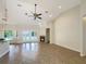Spacious living room with high ceilings, tile flooring, and fireplace at 2513 Andrea Lynn Dr, Lutz, FL 33549