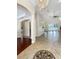Open floor plan with tile floors, high ceilings, and views of kitchen and living room at 2513 Andrea Lynn Dr, Lutz, FL 33549