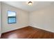 Bright bedroom with hardwood floors and large window at 2513 Andrea Lynn Dr, Lutz, FL 33549