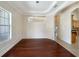 Bright dining room with hardwood floors, chandelier, and view of kitchen at 2513 Andrea Lynn Dr, Lutz, FL 33549