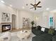 Spacious living room with fireplace, hardwood floors, and large windows at 2513 Andrea Lynn Dr, Lutz, FL 33549