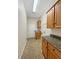Laundry room with built-in cabinets and countertop at 2513 Andrea Lynn Dr, Lutz, FL 33549