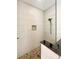 Large walk-in shower with pebble floor and glass enclosure at 2513 Andrea Lynn Dr, Lutz, FL 33549