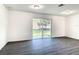 Well-lit bedroom with sliding glass doors leading to backyard at 368 Munoz St, Port Charlotte, FL 33953