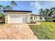 Newly constructed home with a brick driveway and garage at 368 Munoz St, Port Charlotte, FL 33953