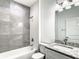 Bathroom with grey marble tile shower and granite vanity at 368 Munoz St, Port Charlotte, FL 33953
