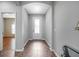 Inviting foyer featuring tile flooring and a decorative glass front door providing natural light at 6722 Wild Elm Ct, Wesley Chapel, FL 33545