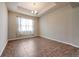 Bright dining room with tile floors and a window with sheer curtains at 6722 Wild Elm Ct, Wesley Chapel, FL 33545