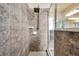 Large walk-in shower with gray tile and rainfall shower head at 6722 Wild Elm Ct, Wesley Chapel, FL 33545