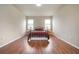 Bedroom with wood flooring and a metal-framed bed at 6722 Wild Elm Ct, Wesley Chapel, FL 33545