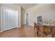 Home office with wood desk, hardwood floors and built-in closet at 6722 Wild Elm Ct, Wesley Chapel, FL 33545