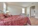 Bedroom with wood flooring, a bed, and an ensuite bathroom at 6722 Wild Elm Ct, Wesley Chapel, FL 33545
