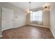 Bright dining room with tile floors and a window with sheer curtains at 6722 Wild Elm Ct, Wesley Chapel, FL 33545