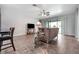 Living room with access to backyard, comfortable seating and a large TV at 6722 Wild Elm Ct, Wesley Chapel, FL 33545