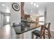 Kitchen island with breakfast bar and dark wood cabinets at 6722 Wild Elm Ct, Wesley Chapel, FL 33545