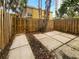 Private fenced backyard featuring a stone patio and a tranquil outdoor space at 3421 S Carter St # C, Tampa, FL 33629
