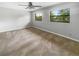 Bright bedroom with ceiling fan and lots of natural light from two windows at 3421 S Carter St # C, Tampa, FL 33629