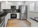 Modern kitchen with stainless steel appliances, granite countertops and ample cabinet space at 3421 S Carter St # C, Tampa, FL 33629
