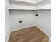 A dedicated laundry room with a shelf above provides convenience at 3421 S Carter St # C, Tampa, FL 33629