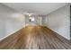 Expansive living room featuring modern wood flooring and neutral paint throughout at 3421 S Carter St # C, Tampa, FL 33629