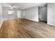 Spacious living room featuring modern wood flooring and neutral paint throughout at 3421 S Carter St # C, Tampa, FL 33629