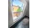 A window view shows the neighborhood's greenery and buildings at 3421 S Carter St # C, Tampa, FL 33629