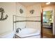 Elegant bathroom with a corner tub, tile accents, and access to the main bedroom at 3240 San Mateo St, Clearwater, FL 33759