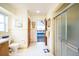 Bright bathroom with shower and commode, with a view to another room in the house at 3240 San Mateo St, Clearwater, FL 33759