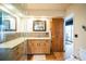 Modern bathroom with a glass enclosed shower, spacious vanity, and wood-style tile floors at 3240 San Mateo St, Clearwater, FL 33759