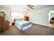 Bright bedroom featuring carpet and a ceiling fan, creating a welcoming atmosphere at 3240 San Mateo St, Clearwater, FL 33759