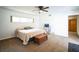 Inviting bedroom with a ceiling fan, a chest, and a cozy comforter at 3240 San Mateo St, Clearwater, FL 33759