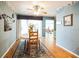 Cozy dining area with wood floors and a view to the backyard at 3240 San Mateo St, Clearwater, FL 33759