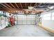 Open garage with a rolling door, providing secure parking and storage space at 3240 San Mateo St, Clearwater, FL 33759