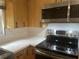 This kitchen features stainless steel appliances, light countertops, and modern tile backsplash at 3240 San Mateo St, Clearwater, FL 33759