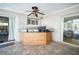 Covered outdoor bar featuring tile countertop and ceiling fan, ideal for entertaining at 3240 San Mateo St, Clearwater, FL 33759