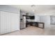 Modern kitchen with dark wood cabinets and stainless steel appliances at 12120 Barnsley Reserve Pl, Gibsonton, FL 33534