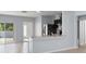 Open concept kitchen with island and view into living room at 12120 Barnsley Reserve Pl, Gibsonton, FL 33534