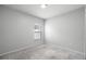 Simple bedroom with neutral walls and carpeted floor at 12120 Barnsley Reserve Pl, Gibsonton, FL 33534