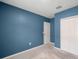 Bedroom with blue walls and closet at 12120 Barnsley Reserve Pl, Gibsonton, FL 33534